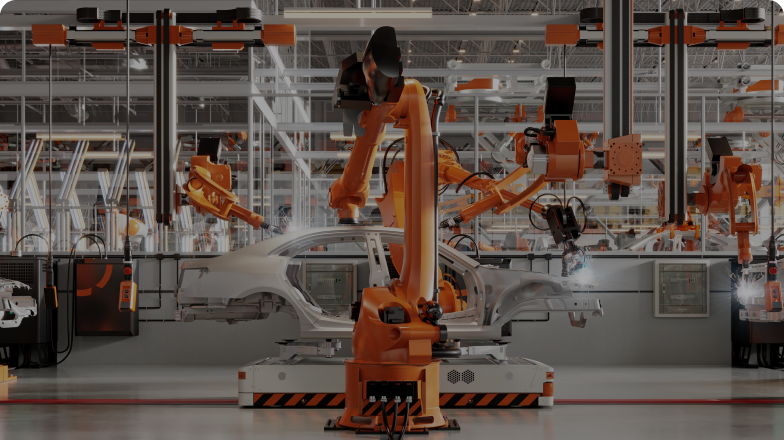 Several industrial robots assemble a vehicle on an assembly line
